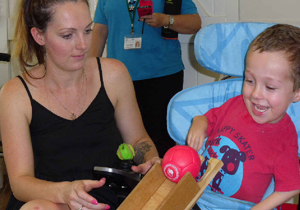 Celia Knight and her son William Brady play his first game of boccia. Celia Knight and her son William Brady play his first game of boccia.